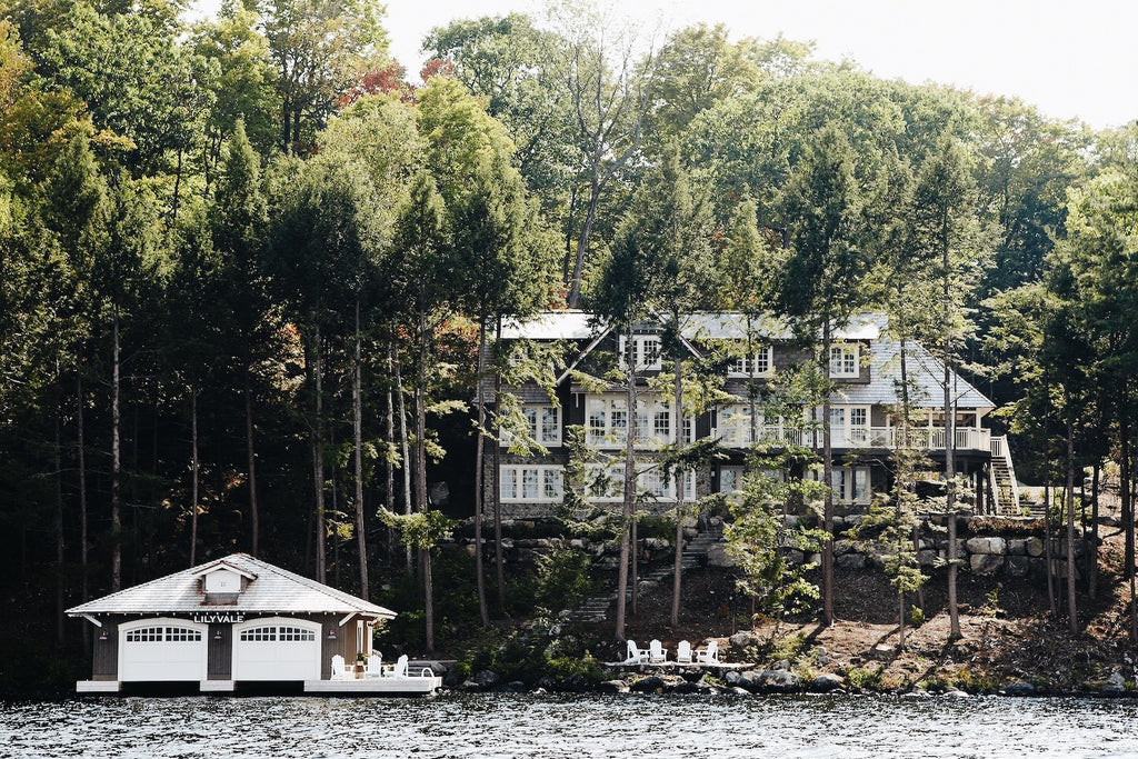 Muskoka Living Projects - Lilyvale Lakehouse designed and built by Muskoka Living. Exterior shot of lakehouse and boathouse from the lake.