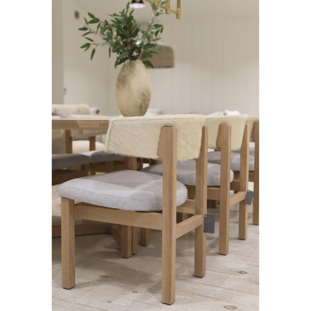 Arch dining chair, shown in Sintra Taupe. Oak finished in Natural. | Muskoka Living Collection