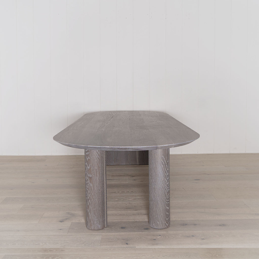 Darby dining table shown in Fumed Smoke | Muskoka Living Collection