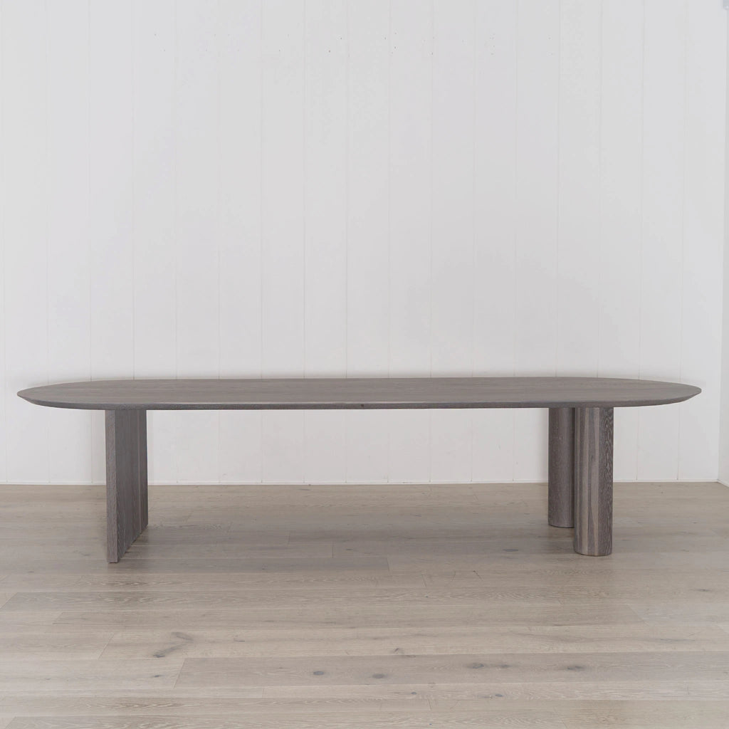 Darby dining table shown in Fumed Smoke | Muskoka Living Collection