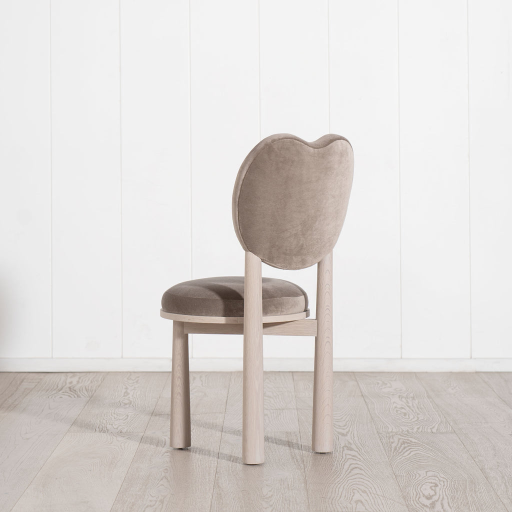 The Violet dining chair  - the Muskoka Living Collection. Made to order at our self-owned and operated workshop in LA. Sintra Taupe and Alpaca White Smoke finish.